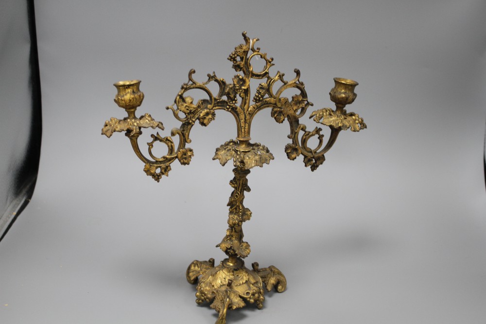 A 19th century French ormolu twin branch candelabrum, modelled with vines and scrolls, height 34cm